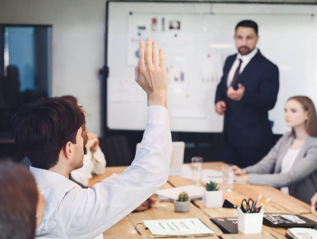 Three-slide discipline shown in an executive meeting with a presenter explaining Context, Reasoned Response, and The Ask